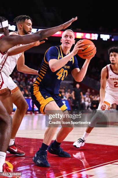 Irvine Anteaters forward Collin Welp defended closely by USC Trojans forward Isaiah Mobley during the college basketball game between the UC Irvine...