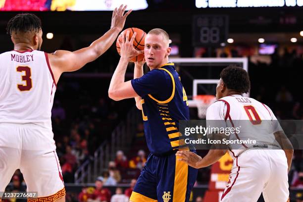 Irvine Anteaters forward Collin Welp defended closely by USC Trojans forward Isaiah Mobley and USC Trojans guard Boogie Ellis during the college...