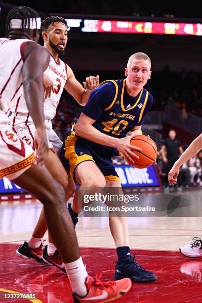 Irvine Anteaters forward Collin Welp defended closely by USC Trojans forward Isaiah Mobley during the college basketball game between the UC Irvine...