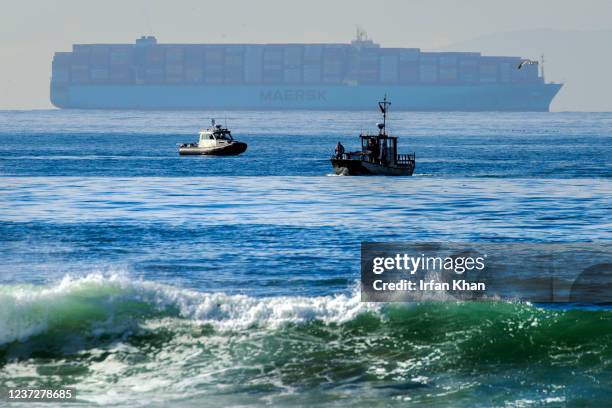 Huntington Beach, TN Boats survey after an oil sheen was spotted, two months after a large oil spill, off the coast of Bolsa Chica State Beach on...