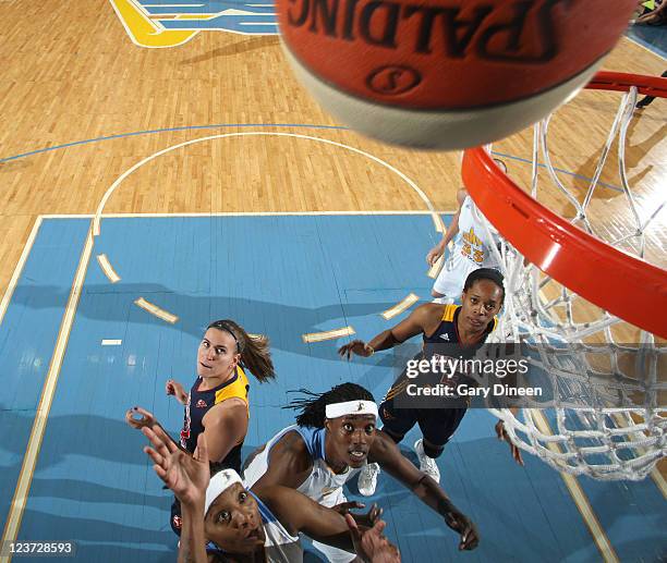 Dominique Canty and Sylvia Fowles of the Chicago Sky battle for position with Jeanette Pohlen and Tangela Smith of the Indiana Fever during the WNBA...