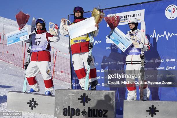 Daichi Hara of Team Japan takes 2nd place, Ikuma Horishima of Team Japan takes 1st place, Mikael Kingsbury of Team Canada takes 3rd place during the...