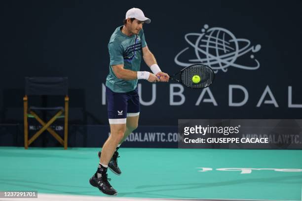 Britain's Andy Murray returns the ball to Spain's Rafael Nadal during their semi-final match of the Mubadala World Tennis Championship in the Gulf...