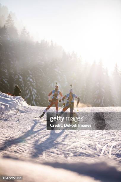 Roberts Slotins of Latvia, Milan Zemlicka of Czech Republic in action competes during the Sprint Men at the IBU World Cup Biathlon Annecy Le Grand...