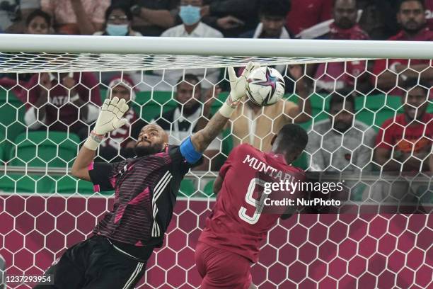 Of Qatar team trying to score and MBOLHI Rais goalkeeper of Algeria team save it during the FIFA Arab Cup Qatar 2021 Semi-Final match between Qatar...