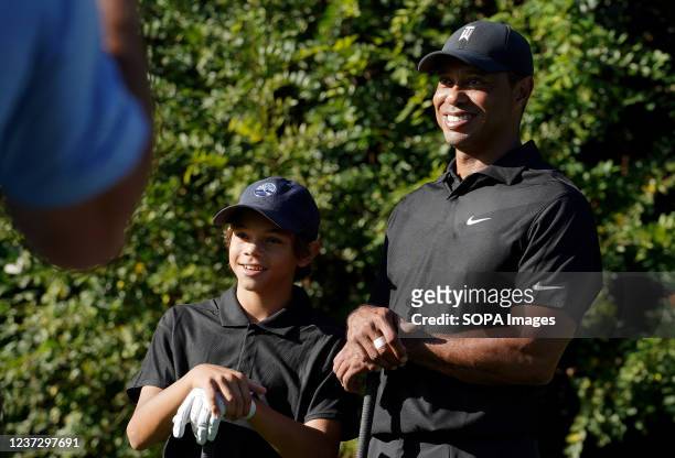 Tiger Woods and his son Charlie pose for photos, during the PNC Championship at the Ritz-Carlton Golf Club. Tiger Woods is making his return to...