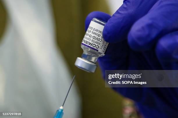 Health worker prepares to administer the Covid-19 booster vaccine, as the booster jab programmes roll-out.