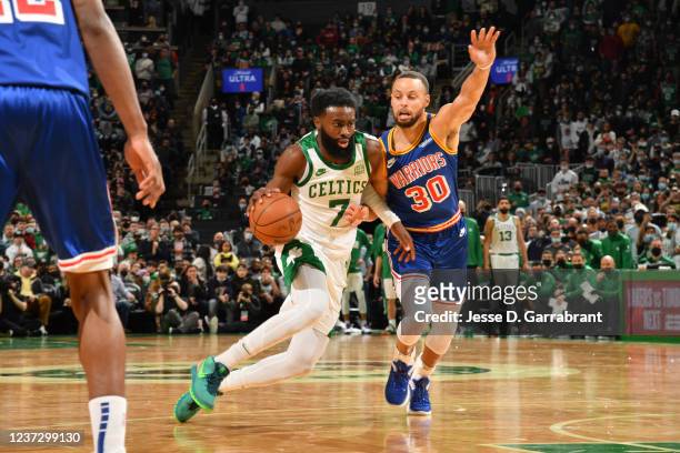 Stephen Curry of the Golden State Warriors plays defense on Jaylen Brown of the Boston Celtics during the game on December 17, 2021 at the TD Garden...