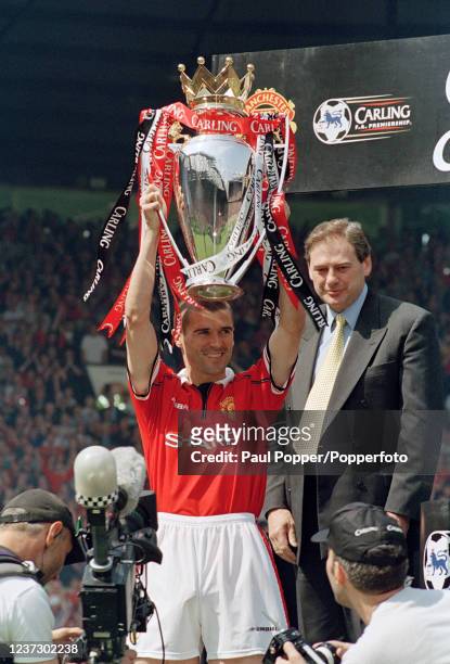 Roy Keane of Manchester United celebrates with the Premiership trophy after the FA Carling Premiership match between Manchester United and Tottenham...