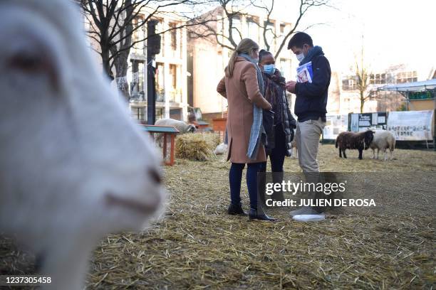 Former French Justice Minister Christiane Taubira speaks with Saint-Denis Mayor Mathieu Hanotin during a visit of an educational farm in Saint-Denis,...