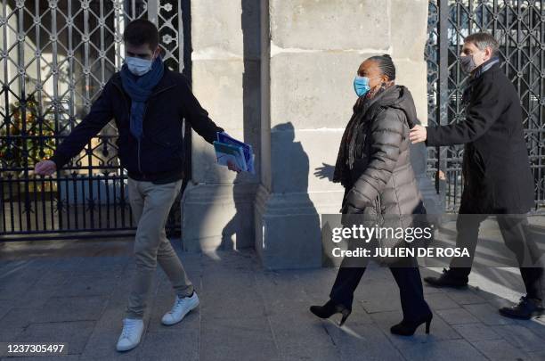 Former French Justice Minister Christiane Taubira walks next to Saint-Denis Mayor Mathieu Hanotin during a visit in Saint-Denis, near Paris, on...