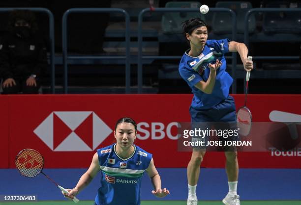 Japan's Yuta Wtanabe and Japan's Arisa Higashino hit a shot to Japan's Kyohel Yamashita and Japan's Naru Shiyona during the mixed doubles semi-final...
