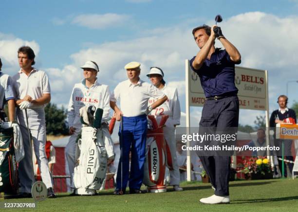 David Feherty of Northern Ireland tees off in the play-off against Ian Baker-Finch of Australia and Christy O'Connor Jnr of the Republic of Ireland...