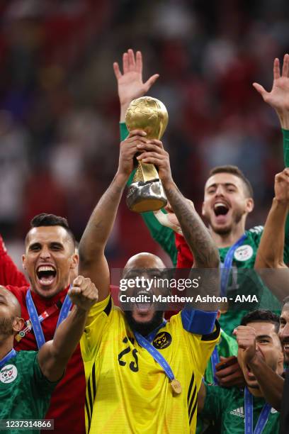 Captain Rais Mbolhi of Algeria lifts the FIFA Arab Cup Trophy after victory in the FIFA Arab Cup Qatar 2021 Final match between Tunisia and Algeria...