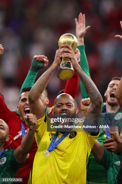 Captain Rais Mbolhi of Algeria lifts the FIFA Arab Cup Trophy after victory in the FIFA Arab Cup Qatar 2021 Final match between Tunisia and Algeria...