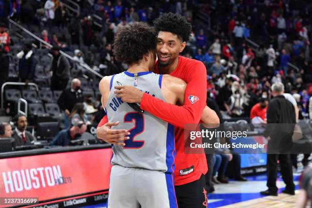 Christian Wood of the Houston Rockets and Cade Cunningham of the Detroit Pistons embrace after the game on December 18, 2021 at Little Caesars Arena...