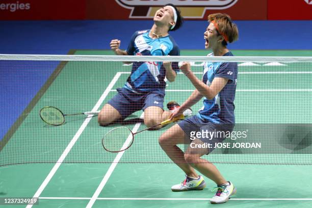 Thailand's Dechapol Puavaranukroh and Sapsiree Taerattanachai celebrate beating Japan's Yuta Watanabe and Arisa Higashino after the mixed doubles...