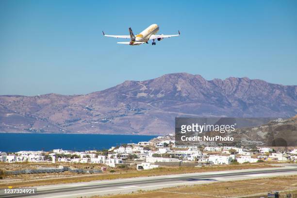 Etihad Airways Airbus A320 aircraft as seen taxiing, departing and flying from Mykonos Airport JMK. The airplane with registration A6-EIU takes the...