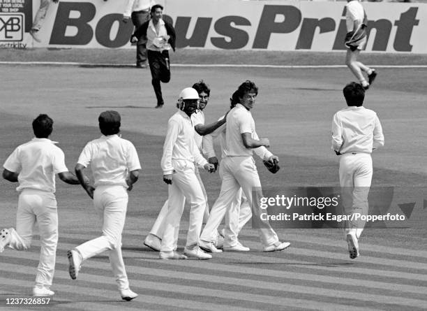 Pakistan captain Imran Khan leads his team from the field after Pakistan win the 3rd Test match between England and Pakistan by an innings and 18...