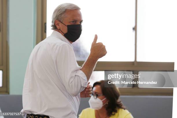 Chilean presidential candidate Jose Antonio Kast of Partido Republicano gestures before castin his vote at a school in Paine during the presidential...