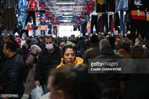 Tourists walk as they shop at a bazaar in Edirne, near Bulgaria border in Turkey on December 17, 2021. - The mosque-filled city of Edirne was an...