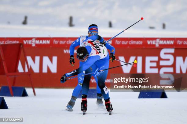 Gael Blondeau of France and Alessandro Pittin of Italy competes during the Individual Gundersen HS98/10km at the FIS World Cup Nordic Combined Men...