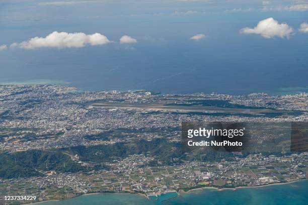 In an aerial view of central Okinawa Island, US Marine Corps Air Station Futenma is seen in Ginowan on December 12, 2021 in Okinawa, Japan. About 70%...