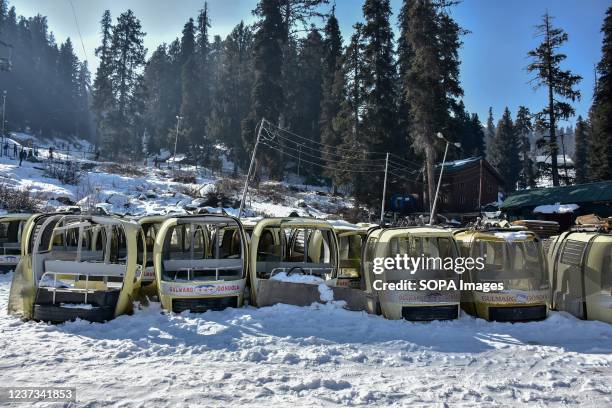 Abandoned cable cars are seen during a cold winter day at a famous ski resort in Gulmarg, about 55kms from Srinagar.