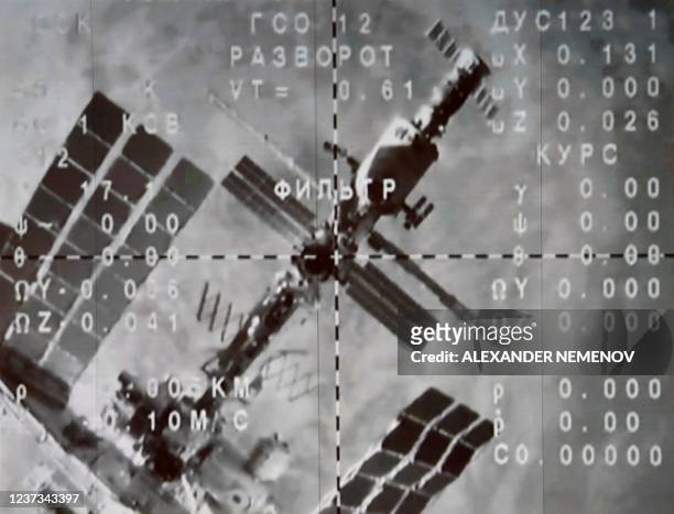 The International Space Station is seen on the monitor after the Soyuz MS-20 space craft undocked from the ISS, starting the landing of the...