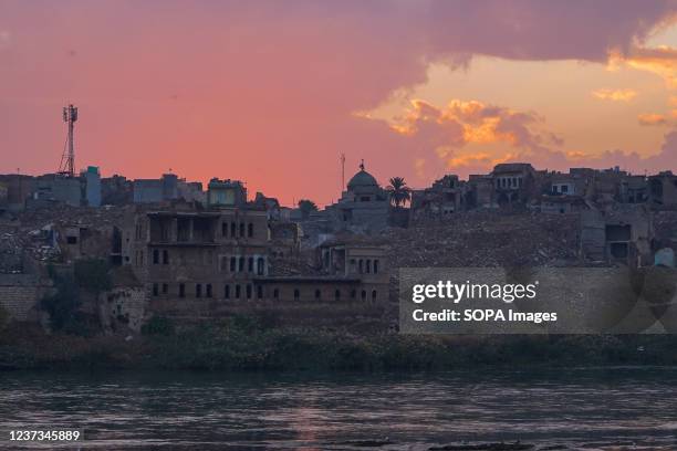 Sunset behind the old area along Tigris River in the northern Iraqi city of Mosul.