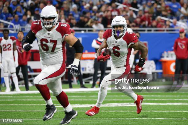 Arizona Cardinals running back James Conner runs with the ball while Arizona Cardinals offensive guard Justin Pugh blocks during a regular season NFL...