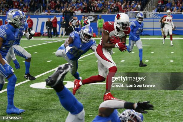 Arizona Cardinals wide receiver A.J. Green runs with the ball after catching a pass while Detroit defenders pursue during a regular season NFL...