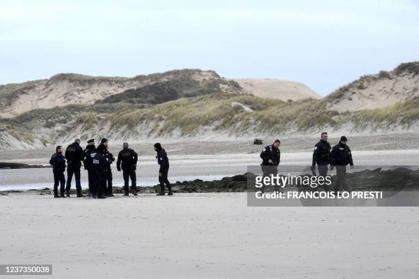 Police patrol on the Wimereux beach, northern France, on December 20, 2021 as humanitarian association has filed manslaughter charges against...
