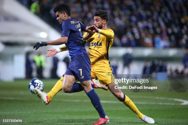 Luis Diaz of FC Porto and Bruno Wilson of FC Vizela battle for the ball during the Liga Portugal Bwin match between FC Vizela and FC Porto at the...