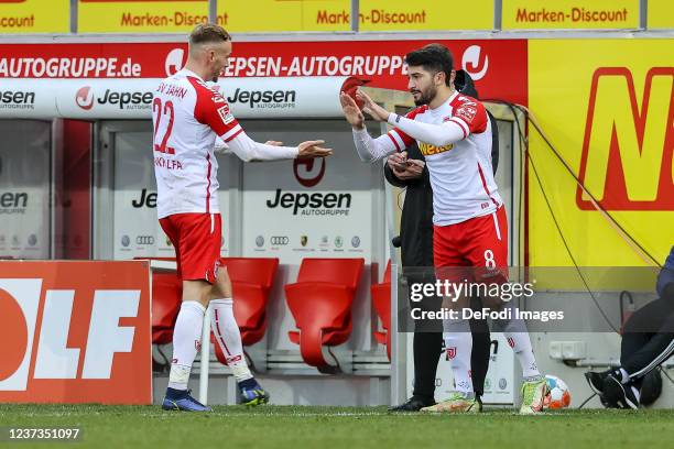 Carlo Boukhalfa of SSV Jahn Regensburg and Ayguen Yildirim of SSV Jahn Regensburg substitutes during the Second Bundesliga match between SSV Jahn...