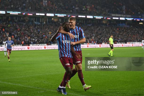 Trabzonspor's Cape Verdean forward Djaniny celebrates with Trabzonspor's Danish forward Andreas Cornelius after scoring a goal during the Super...