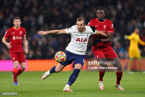 Harry Kane of Tottenham Hotspur tangles with Ibrahima Konate of Liverpool during the Premier League match between Tottenham Hotspur and Liverpool at...