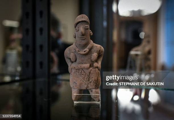 This picture taken on December 20, 2021 shows an archeological piece displayed at the Mexican Embassy in Paris. - The Mexican embassy in France has...