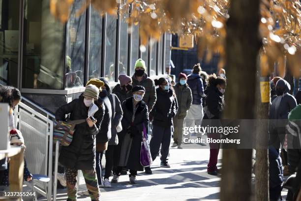 Line outside a New York City Health and Hospitals Covid-19 testing site in the Lower East Side neighborhood of New York, U.S., on Monday, Dec. 20,...