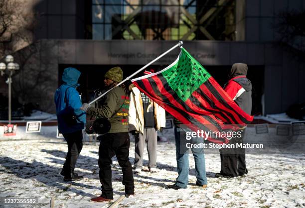 People demonstrate in support of the family of Daunte Wright outside the Hennepin County Government Center on December 20, 2021 in Minneapolis,...