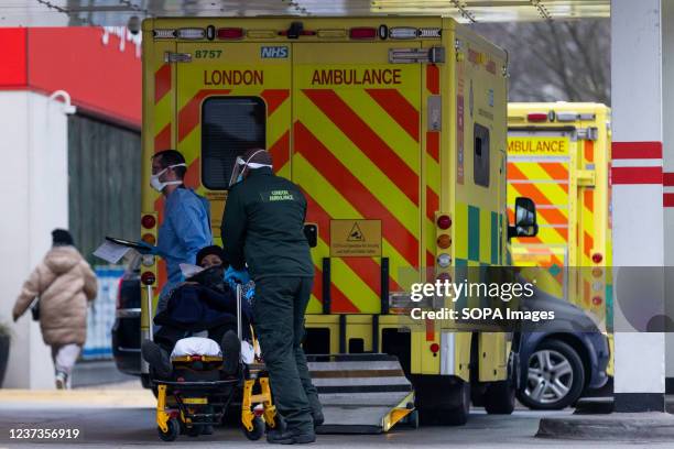 Paramedics wheel a stretcher towards the Accident and Emergency entrance at St Thomas Hospital in London. Covid-19 hospitalisations are rising in the...
