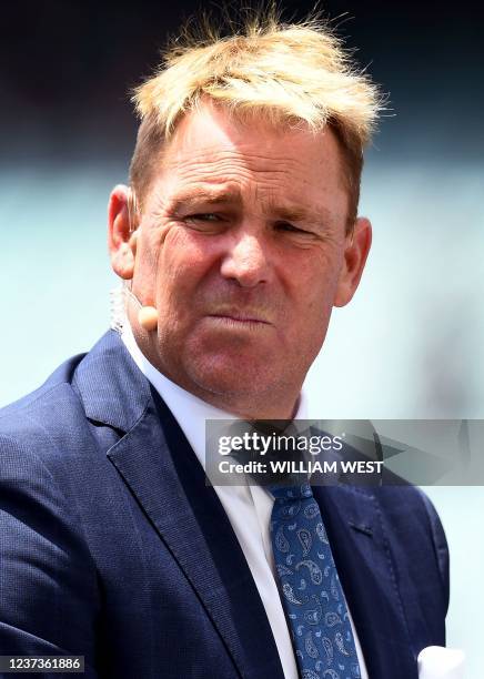 Photo taken on December 19, 2021 shows former Australia player and commentator Shane Warne presenting during a break in play on the fourth day of the...