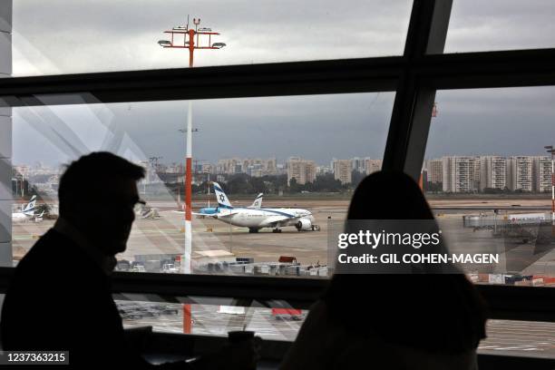 This picture taken on December 21, 2021 shows a view of a Boeing 787-8 Dreamliner aircraft of Israel's El Al at Ben Gurion Airport in Lod, east of...