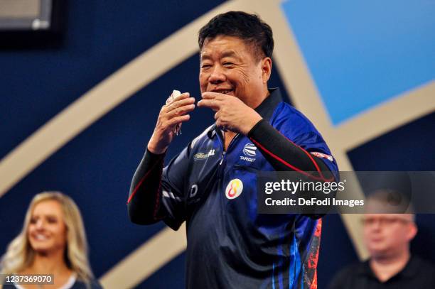 London, England, : Paul Lim looks on in the match against Joe Murnan during the PDC William Hill World Darts Championship at Alexandra Palace on...