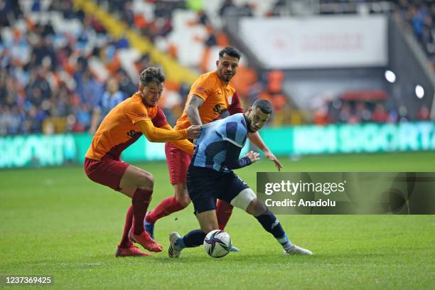 Belhanda of Adana Demirspor in action against Ogulcan Caglayan of Galatasaray during the Turkish Super Lig soccer match between Adana Demirspor and...