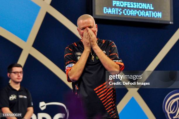 London, England, : Raymond van Barneveld looks on in the match against Lourence Ilagan during the PDC William Hill World Darts Championship at...