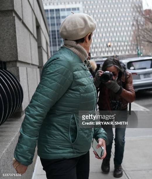 Isabelle Maxwell, sister of Ghislaine Maxwell, is followed by a photographer as she arrives at the US Court House in New York on December 21 as a...