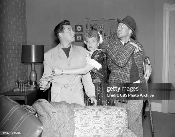 Episode "The Quiz Show " shown here: From left to right, Desi Arnaz as Ricky Ricardo, Lucille Ball as Lucy Ricardo and John Emery. Image dated...