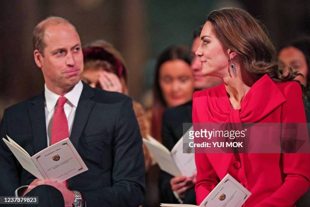 Britain's Prince William, Duke of Cambridge and Britain's Catherine, Duchess of Cambridge take part in 'Royal Carols - Together At Christmas', a...