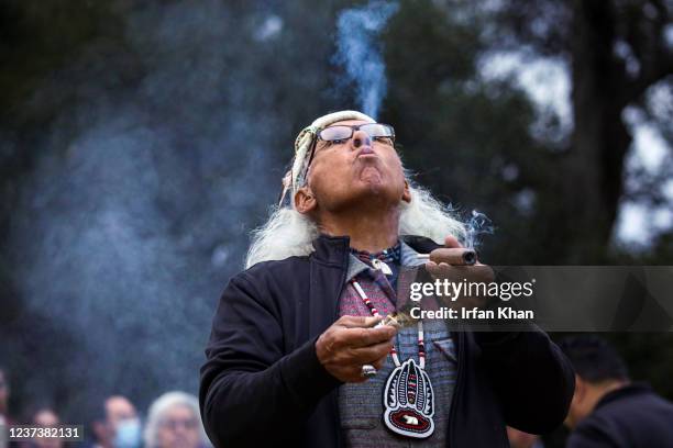 Chatsworth, CA Alan Salazar, a Chumash and Tataviam elder, blows sacred tobacco smoke at a Native American prayers held in honor of winter solstice,...